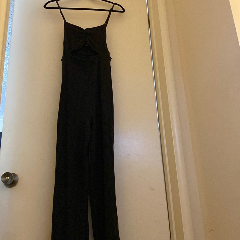black ribbed jumpsuit with a slight flare bottom never worn